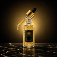 Sérum de Oro 24K Aurelia, gotero en ángulo con una gota de sérum dorado